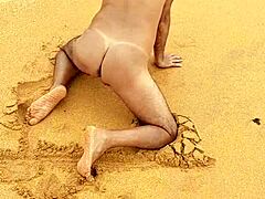 A hot gay Latino guy shows off his ass on the beach in this video