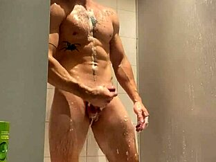 Cute naked lad with large cock enjoys the moist sweaty session in the gym shower