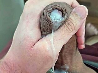 A gay Brazilian twink strips and exposes his huge hard cock before getting into a mischievous mood