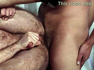 Muscular man dominates hairy guy