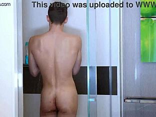 Adrian’s ass is widely opened up by a black cock in the shower.