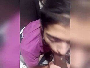 A young gay amateur gives a blow job to a big black cock in public