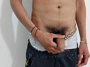 A bisexual amateur masturbates his uncut cock